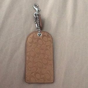 Tan coach luggage tag